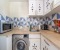 Waschmaschine, Wasserkocher, Toaster und Mikrowelle