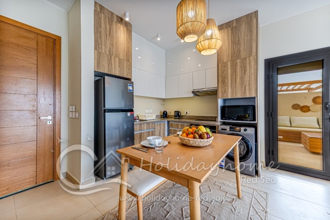 Voll ausgestattete K&uuml;che mit Zugang zur tollen Dachterrasse